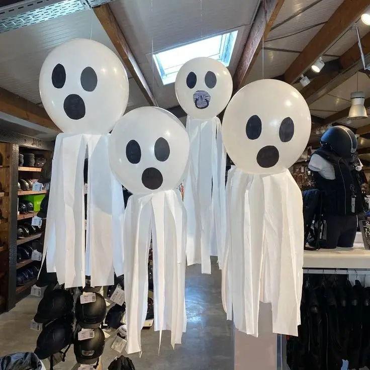 Give Your Screen a Spooky Glow With These 17 Halloween Wallpaper Ideas 2 Cute Floating Ghosts
