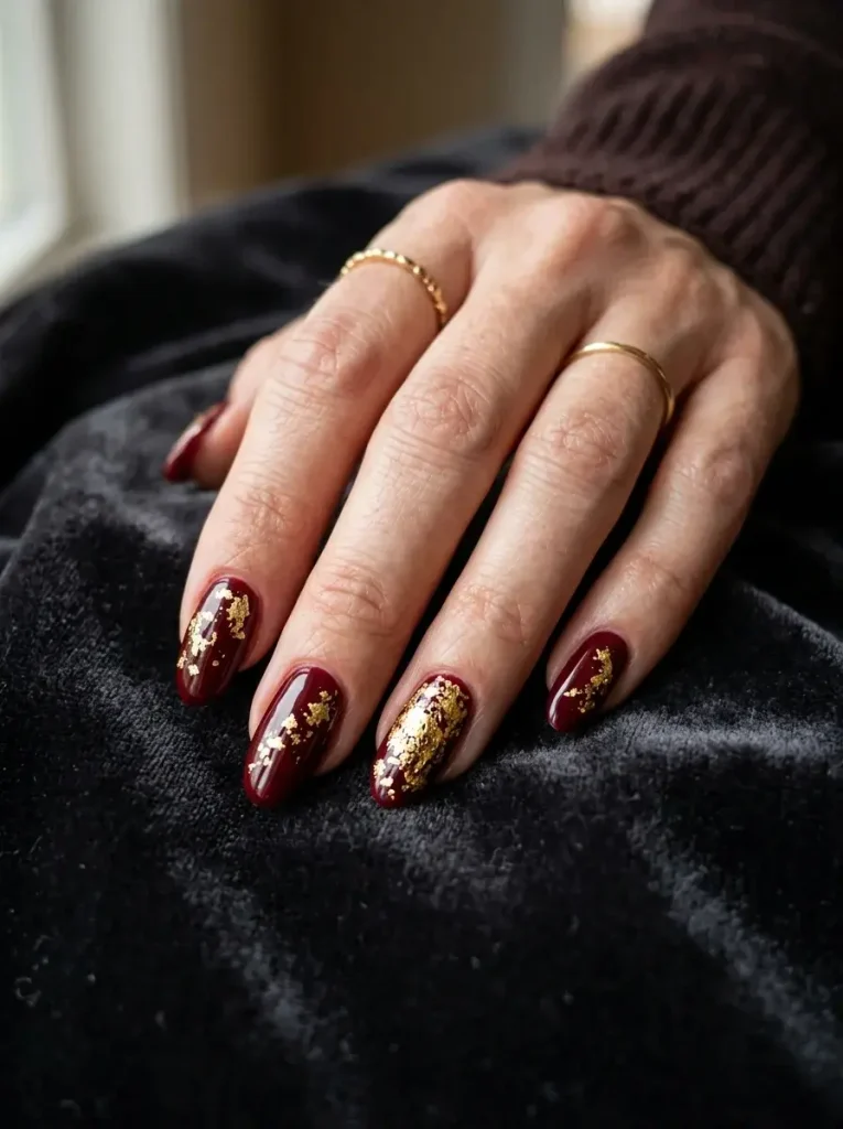 15 Red Fall Nails That Will Make Your Autumn Manicure Look Rich and Luxurious 11 Merlot with Gold Leaf or Foil