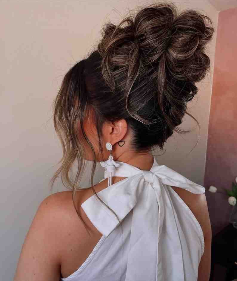 Love Is in the Hair: 15 Valentine's Day Hairstyles for Every Kind of Date 10 Messy Top Knot With a Bow