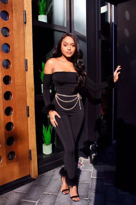 Cold Weather, Main Character Energy: 13 Baddie Fall Outfits 12 Off Shoulder Catsuit With a Chain Belt