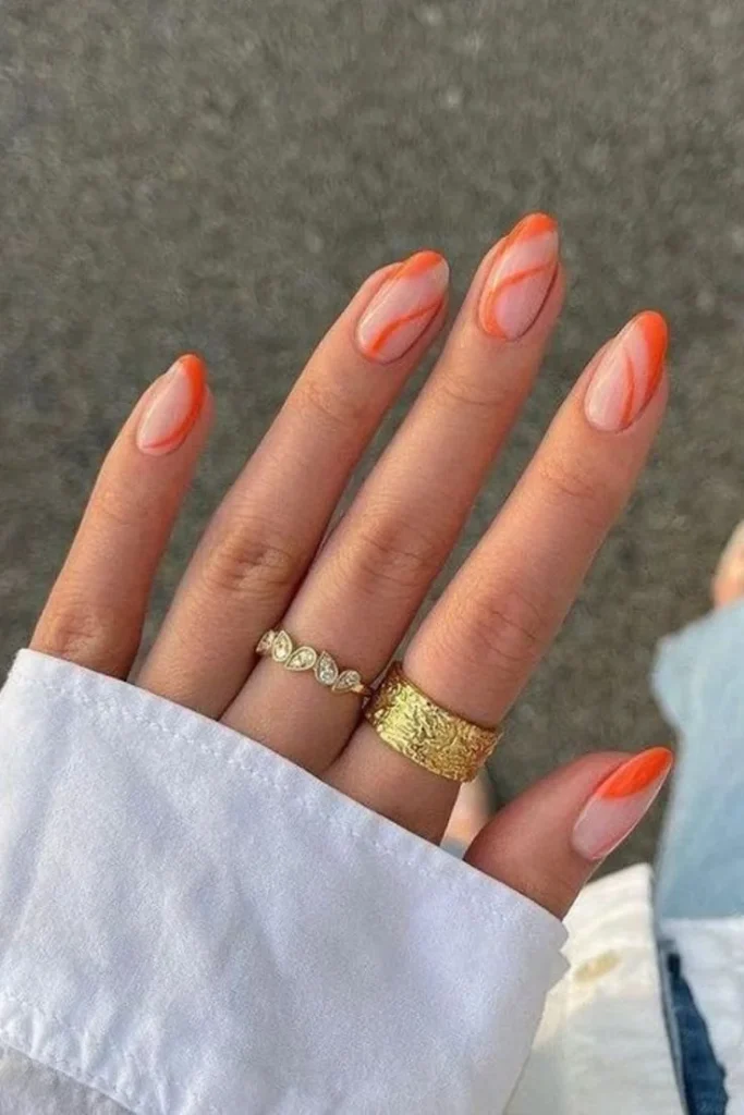 13 Fall Orange Nails That Make Autumn Feel Extra Cozy 6 Orange Swirl Nails