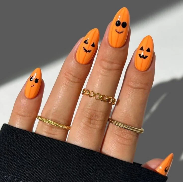 14 Fall Pumpkin Nails That Make Autumn Manicures Feel Extra Cozy 12 Orange Swirl Pumpkin Nails