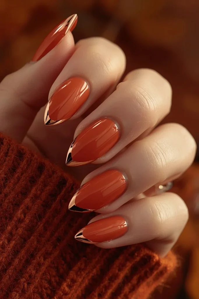 13 Fall Orange Nails That Make Autumn Feel Extra Cozy 4 Orange and Gold Accent Nails
