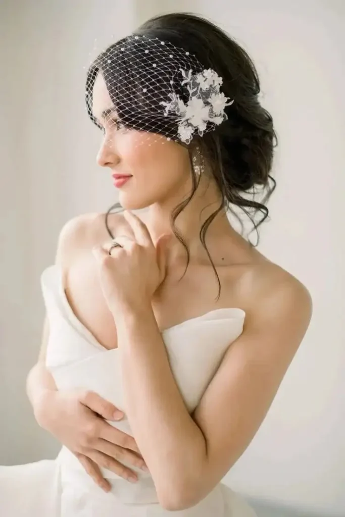 The Bridal Lookbook: 18 Wedding Hairstyles with Veil That Feel Truly Special 15 Short Bob with a Birdcage Veil