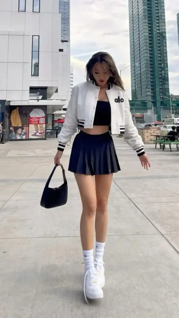 Your Fall Wardrobe Just Got Smarter With These 15 Preppy Fall Outfits 10 Varsity Jacket With a Tennis Skirt
