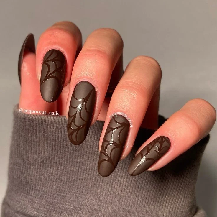 Fall Gets Spooky With These 19 Fall Halloween Nails You’ll Want to Copy 4 Chocolate Brown Spiderweb Nails