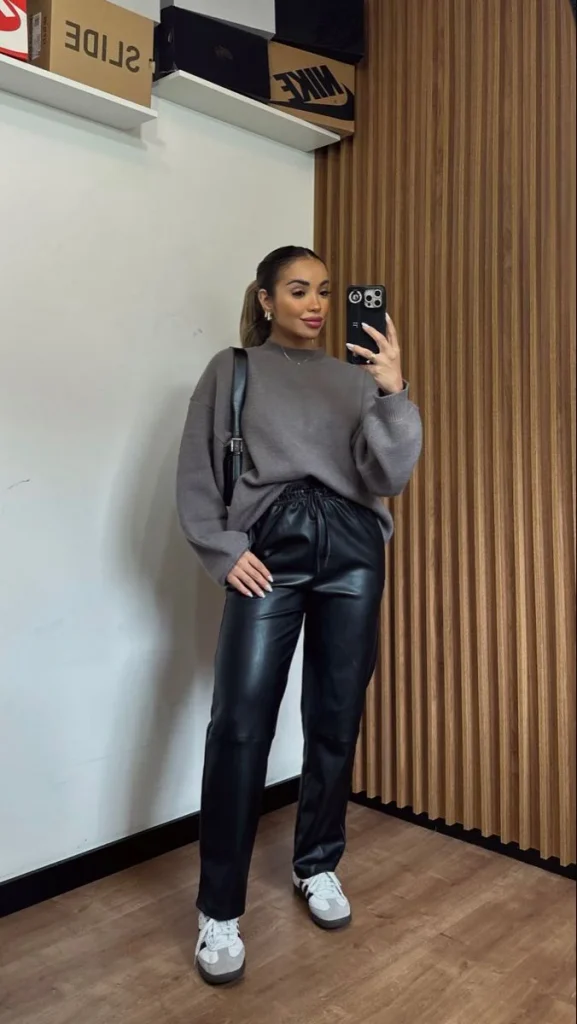 17 Fall Outfits With Sneakers That Look Stylish & Comfortable 15 Gray Sweater With Leather Pants And Sneakers