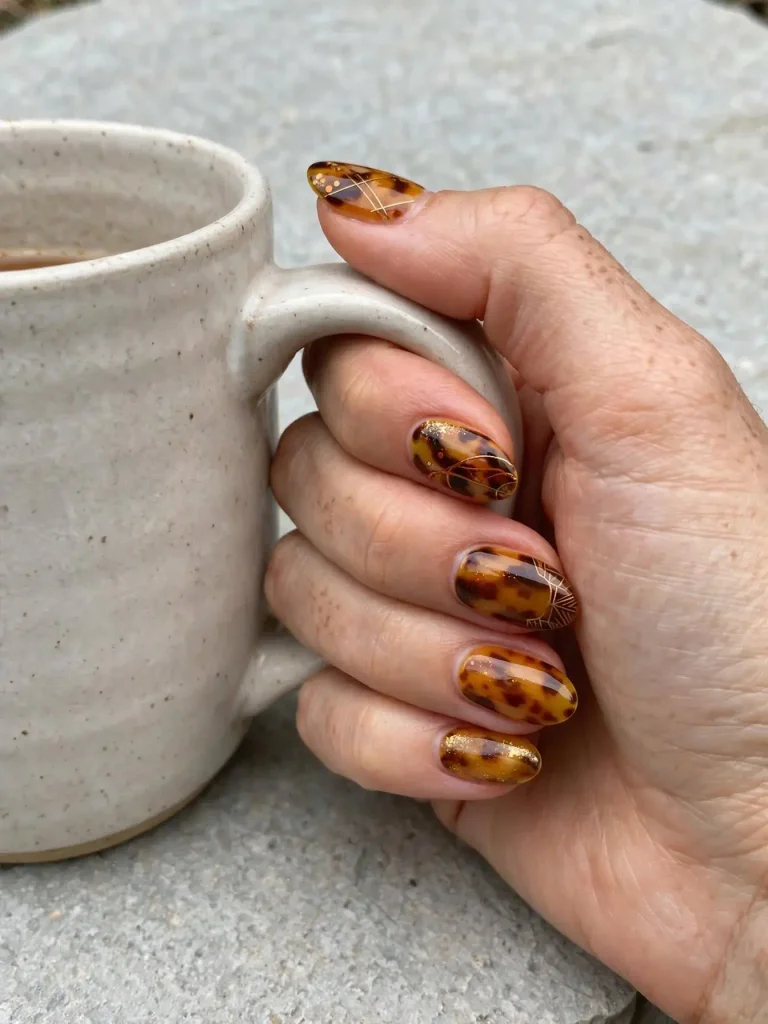 14 Fall Nails With Designs, One for Every Week of the Season 4 Honey Tortoiseshell 768x1024 1