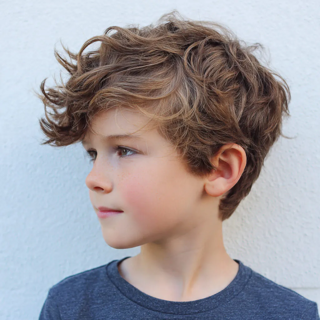 14 Boy Hairstyle Ideas That Are Seriously Cool Right Now 14 wavy side sweep for boy