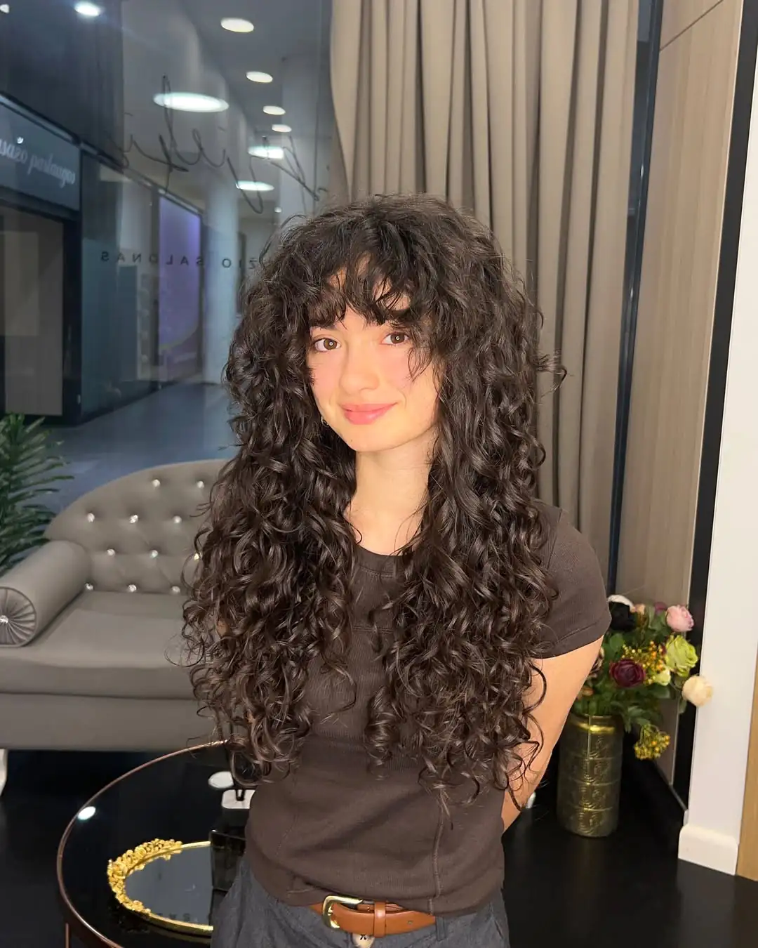 15 Unexpected Hairstyles With Bangs That Are Taking Over Pinterest 7 Curly bangs with layered curls