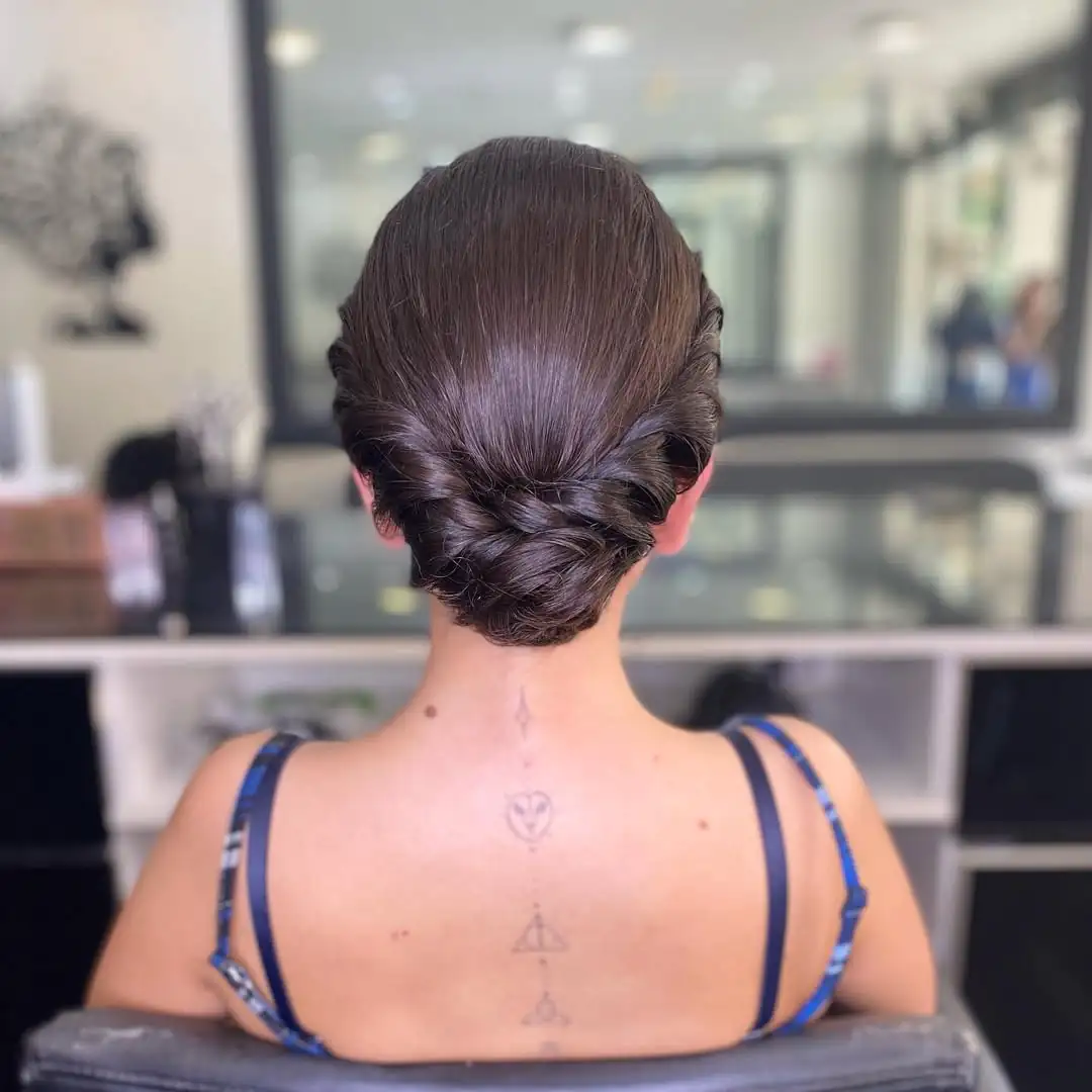 14 Work Hairstyle Ideas That Make You Look Effortlessly Put-Together (Even on 3 Hours of Sleep) 14 Low Braided Bun