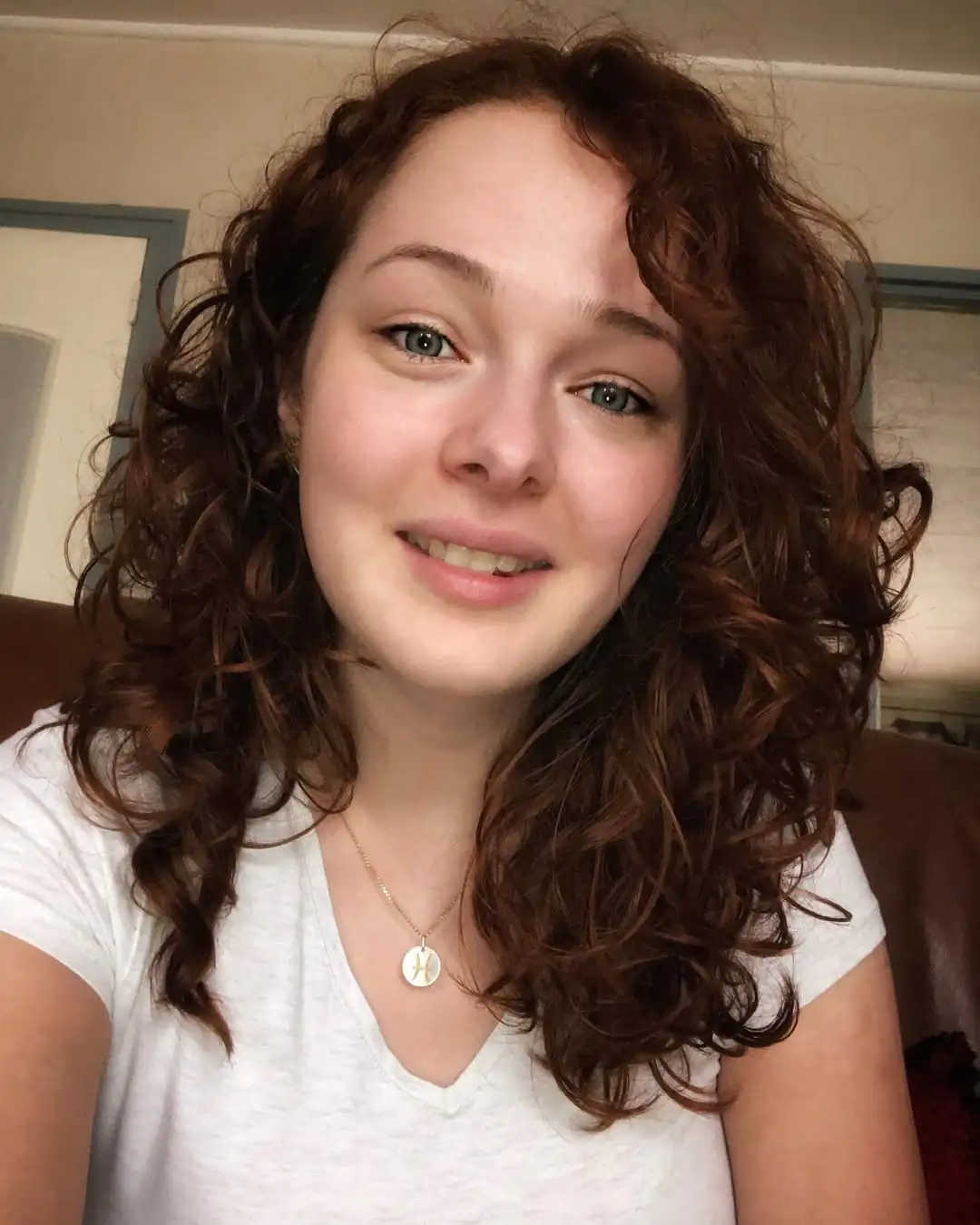 16 Short Curly Hairstyles for Women That Are Basically Effortless Chic 9 Side-Parted Curly Crop
