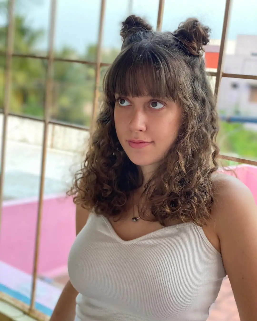 16 Easy Hairstyles for Thick Hair That Will Instantly Upgrade Your Look (Zero Stress, All Style) 10 Space Buns