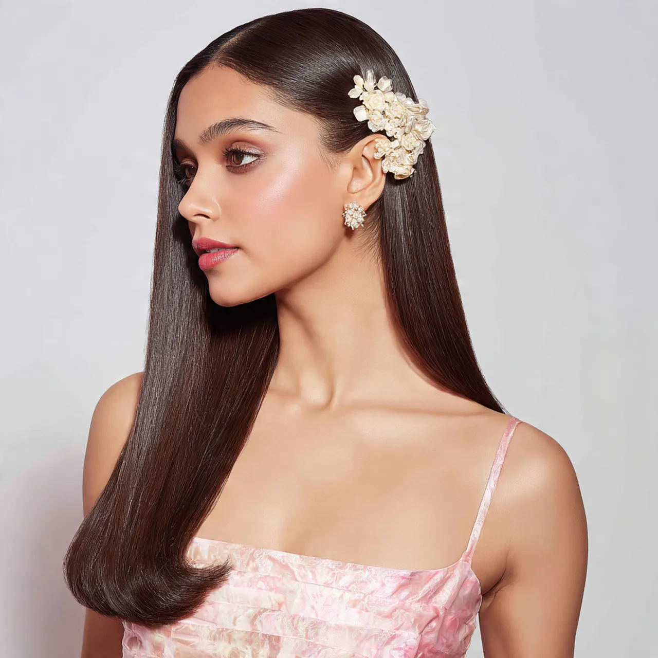 16 Flower Girl Hairstyle Ideas That Are Straight-Up Adorable (and Actually Easy to Do) 12 Sleek Straight Hair with Floral Clip